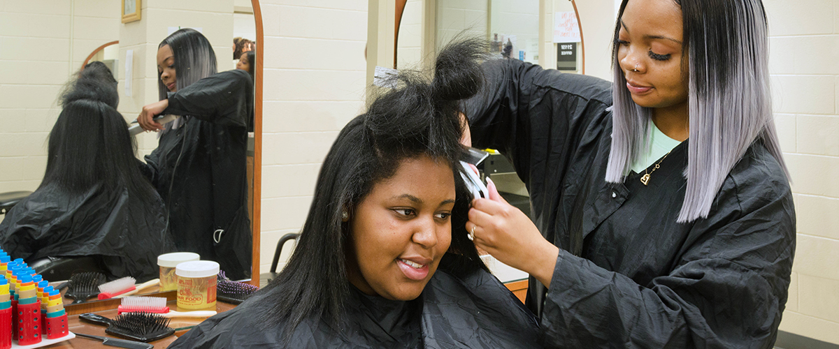 Student in training with straighten hair