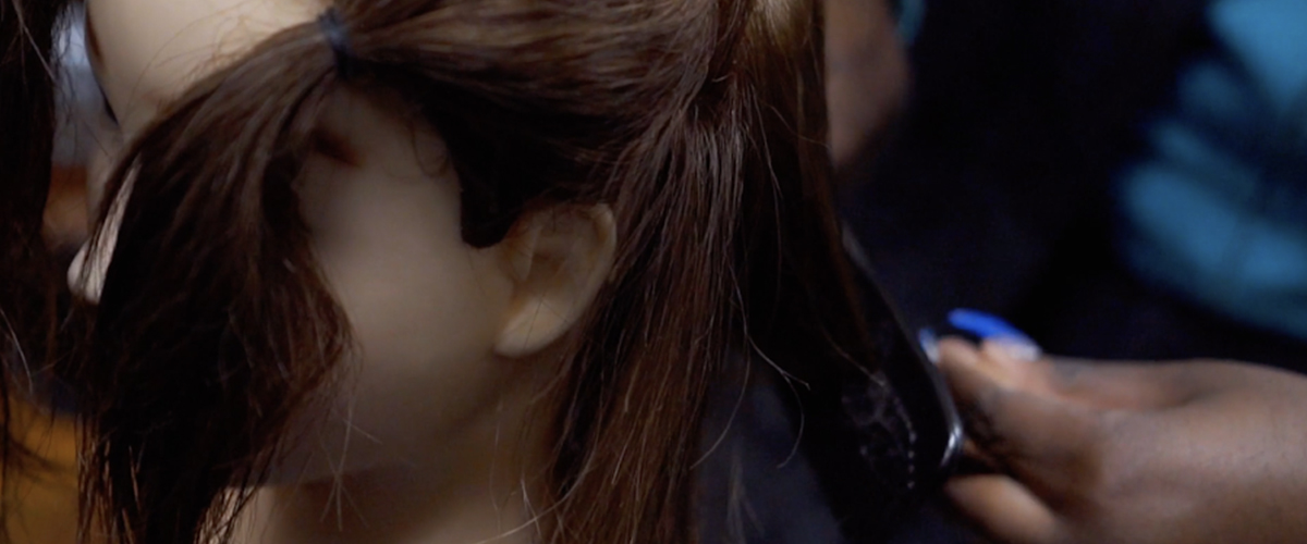 Student prepping hair